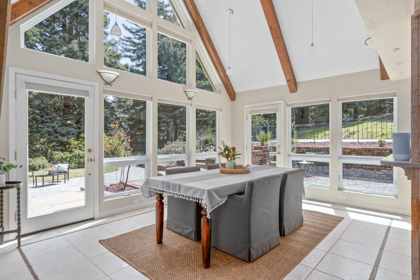 394 Summit Road Watsonville, CA 95076 - Photo 8 of 26 a view of a dining room with furniture large windows and wooden floor
