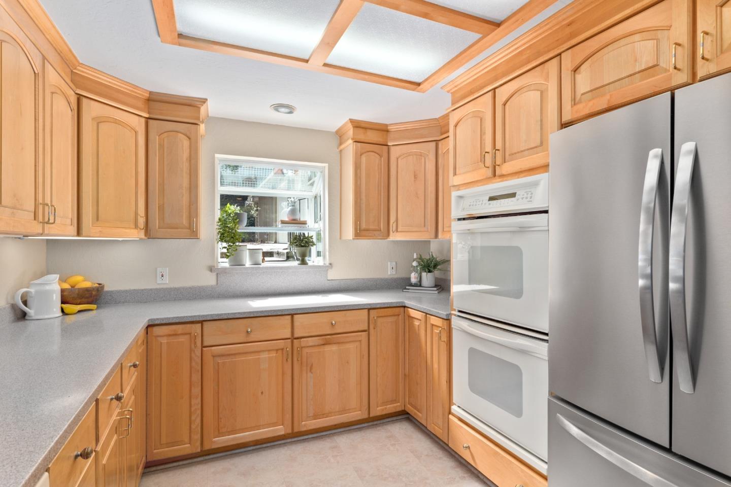 394 Summit Road Watsonville, CA 95076 - Photo 10 of 26 a kitchen with a sink a refrigerator and cabinets