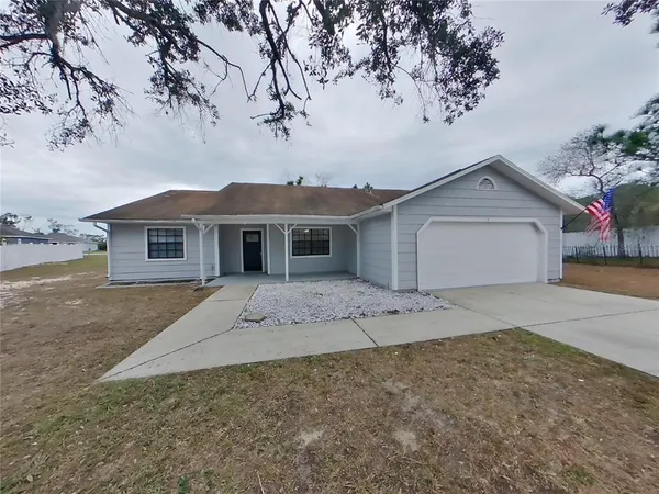 front view of a house with a dry yard