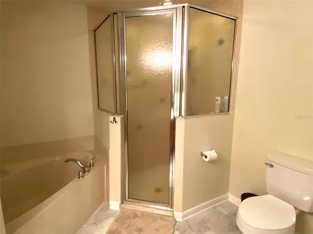 a bathroom with a tub and shower