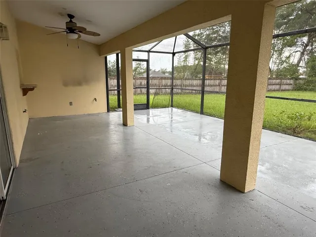 a view of an empty room with a balcony