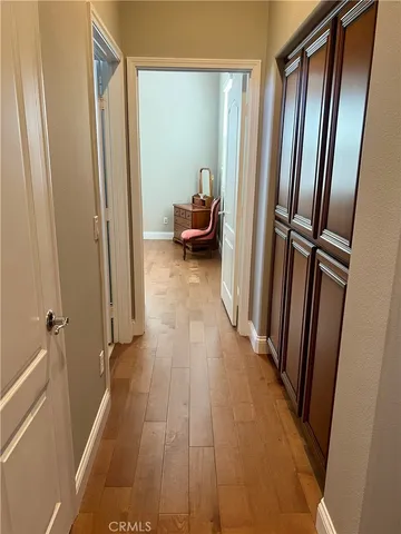 a view of a hallway with furniture and stairs