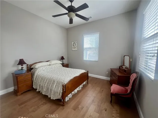 a bed room with a bed and a chair