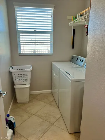 a utility room with a window dryer and washer