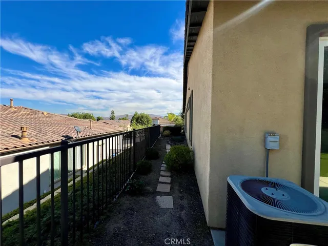 a view of balcony with furniture
