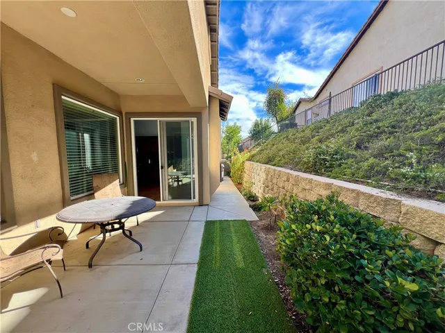 a view of a patio with chair and table