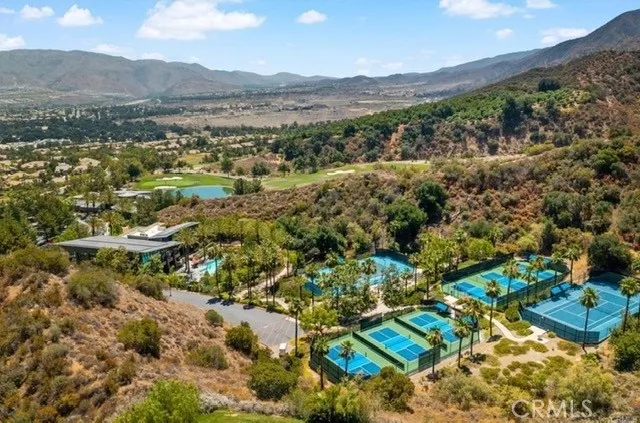 a view of an outdoor space and basketball court