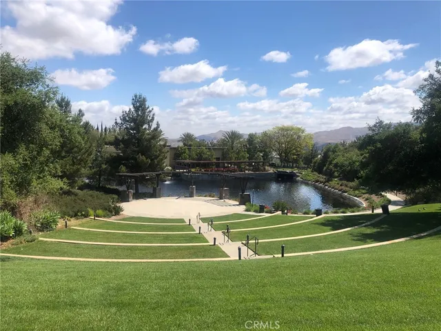 a view of a house with a mountain in the background