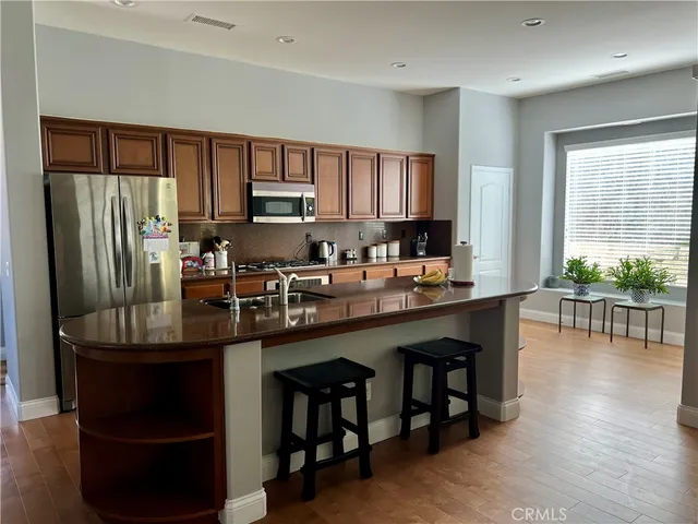 a kitchen with counter top space cabinets and appliances