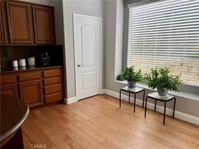 a view of kitchen with furniture and cabinets