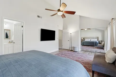 a bathroom with a double vanity sink mirror and cabinets