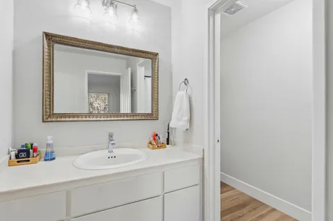 a bathroom with a glass shower door