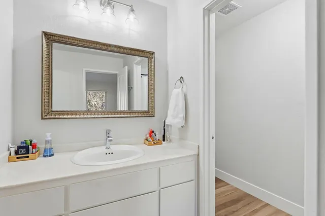 a bathroom with a glass shower door