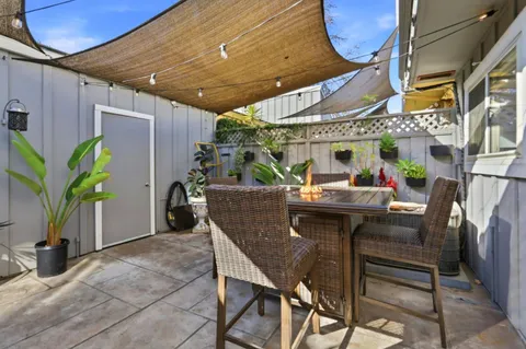 a view of a chairs and table in a patio