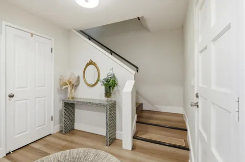 a bedroom with a bed and a chair