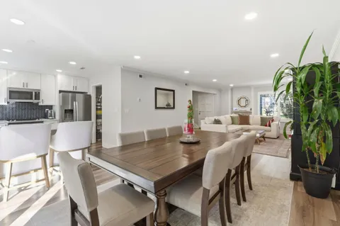 a kitchen with kitchen island a refrigerator stove and microwave