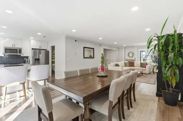 a kitchen with kitchen island a refrigerator stove and microwave