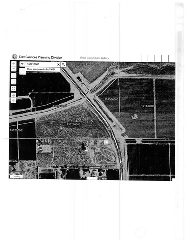 a view of a lake with houses in the back