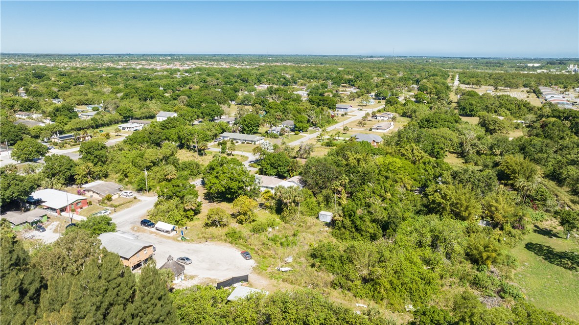 4560 32nd Avenue Vero Beach, FL 32967 - Photo 10 of 13 an aerial view of residential houses with outdoor space and trees