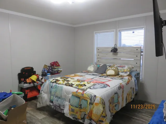 a bedroom that has a bed and a window