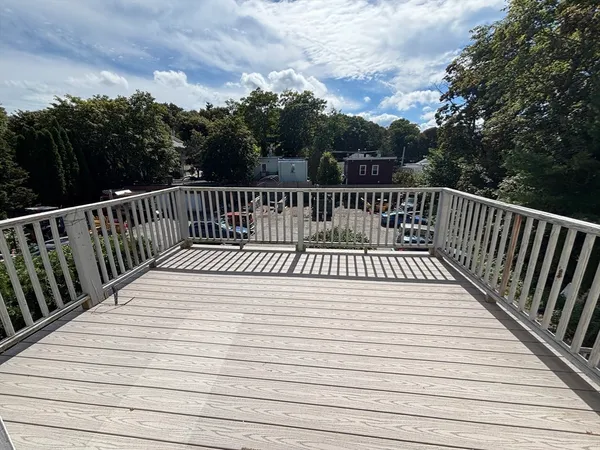 a view of deck with wooden floor and fence