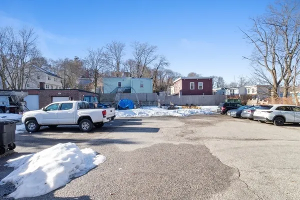 a view of street with parked cars