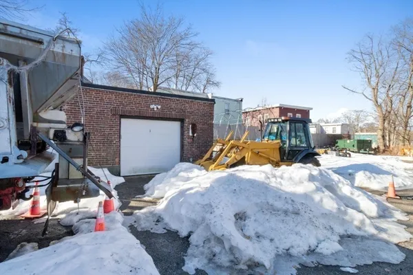a bedroom with a bed and a table
