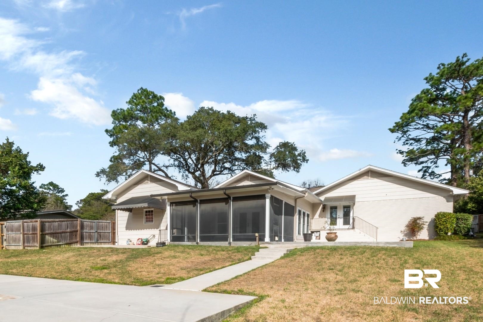231 Rochester Road Mobile, AL 36608 - Photo 47 of 51 Rear view of house with a yard and a sunroom
