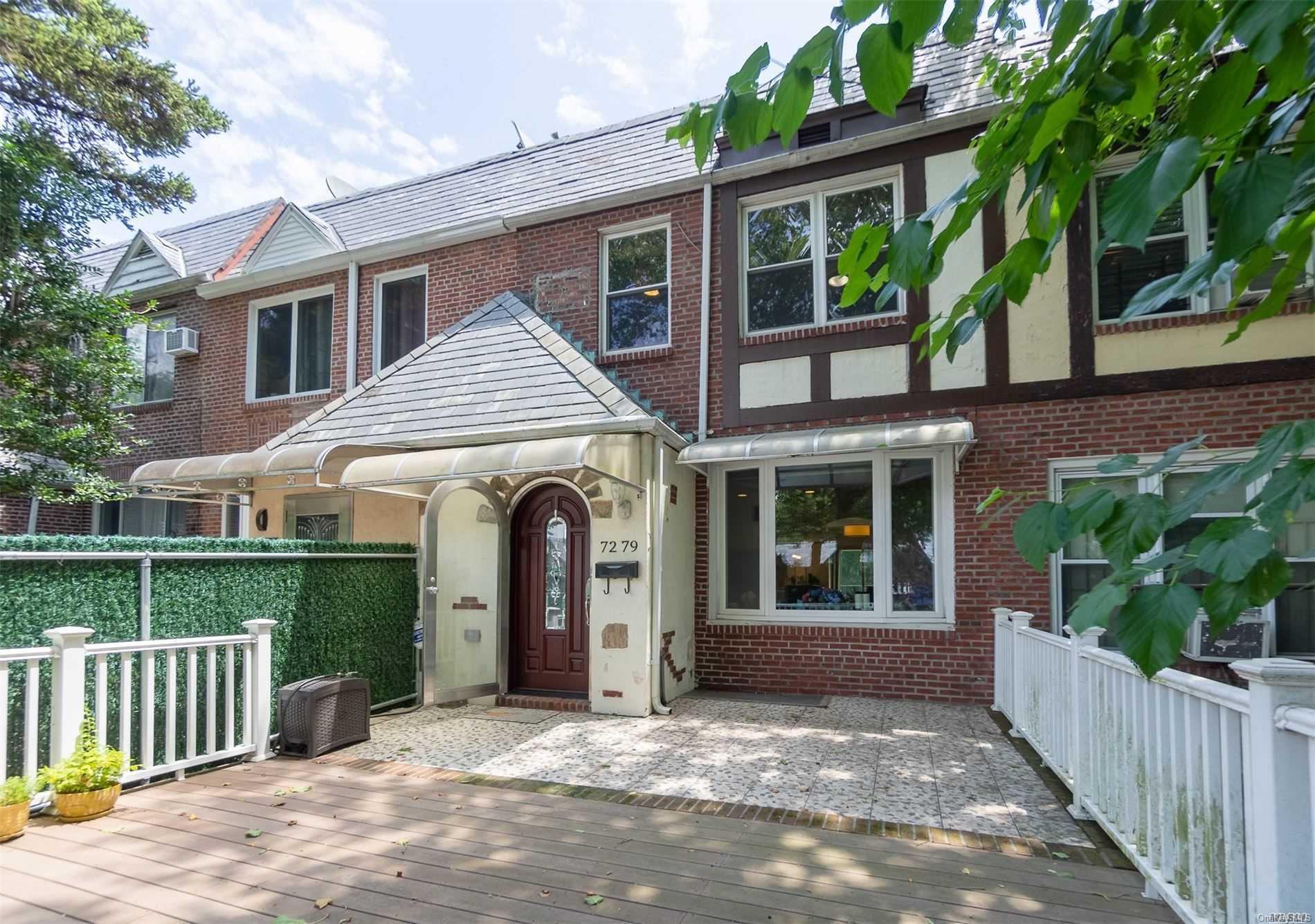 72-79 Yellowstone Boulevard Queens, NY 11375 - Photo 1 of 1 front view of a house with a porch