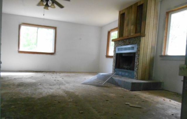 17294 Sumner Road Pecatonica, IL 61063 - Photo 8 of 10 a view of empty room with a fireplace