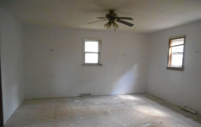 17294 Sumner Road Pecatonica, IL 61063 - Photo 9 of 10 an empty room with a window and a fan