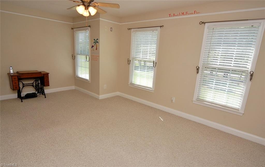 6205 Monnett Road Julian, NC 27283 - Photo 18 of 30 The second bedroom receives ample natural light.