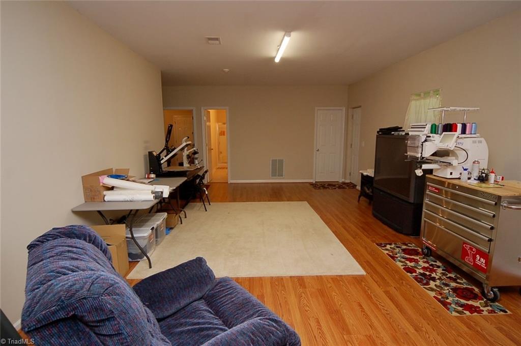 6205 Monnett Road Julian, NC 27283 - Photo 23 of 30 Lots of versatile space! The finished basement has its own exit to the back yard.