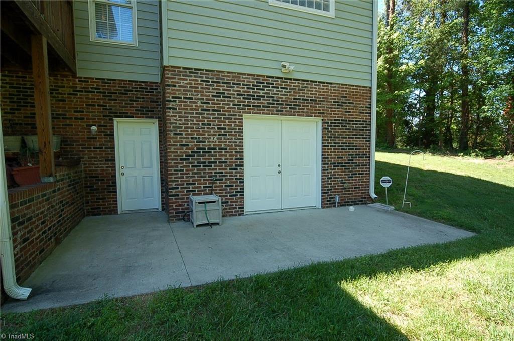 6205 Monnett Road Julian, NC 27283 - Photo 24 of 30 Entry to the basement (left) and crawl space (right).