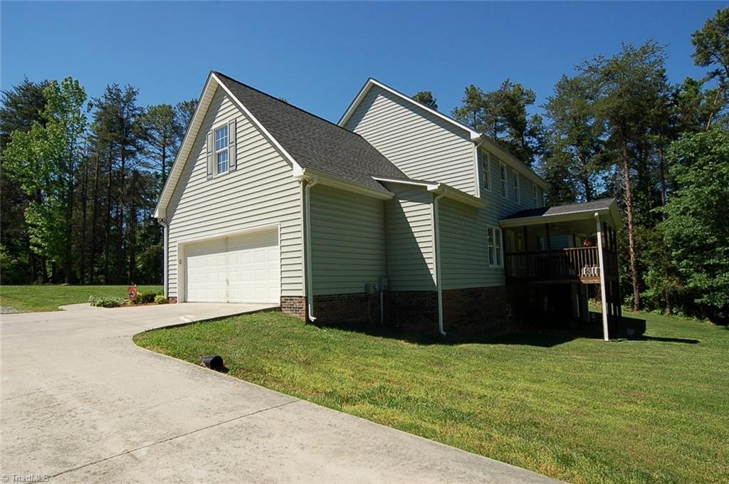 6205 Monnett Road Julian, NC 27283 - Photo 27 of 30 Side view of home. The two car attached garage is 26x24 to allow parking for a truck.