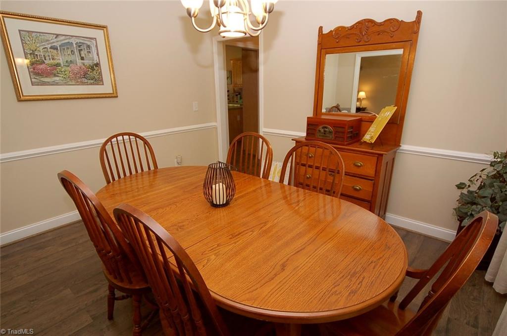 6205 Monnett Road Julian, NC 27283 - Photo 10 of 30 The formal dining room is just off the kitchen.