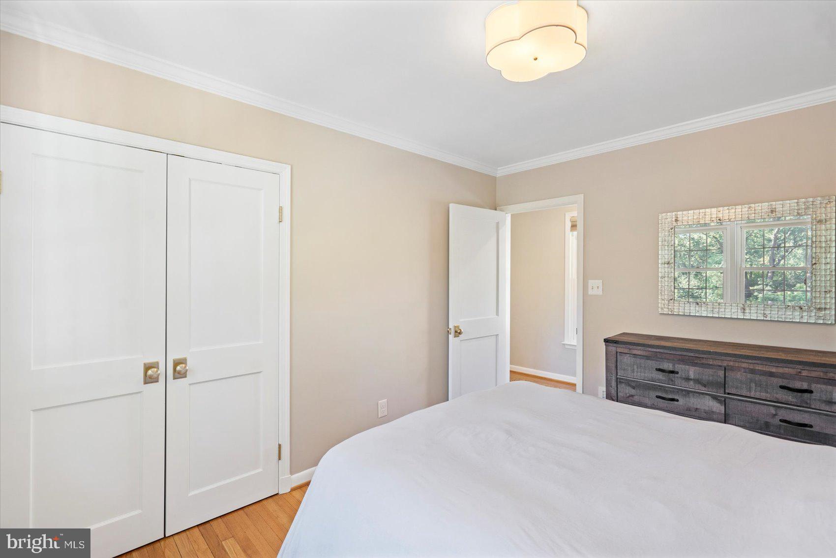 2413 Stanwick Road Phoenix, MD 21131 - Photo 11 of 46 a spacious bedroom with a bed and a window