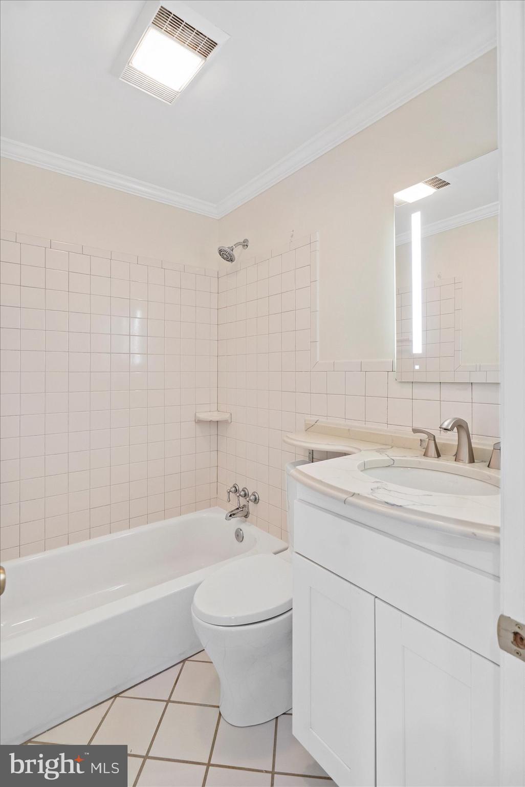 2413 Stanwick Road Phoenix, MD 21131 - Photo 12 of 46 a bathroom with a sink a toilet and shower