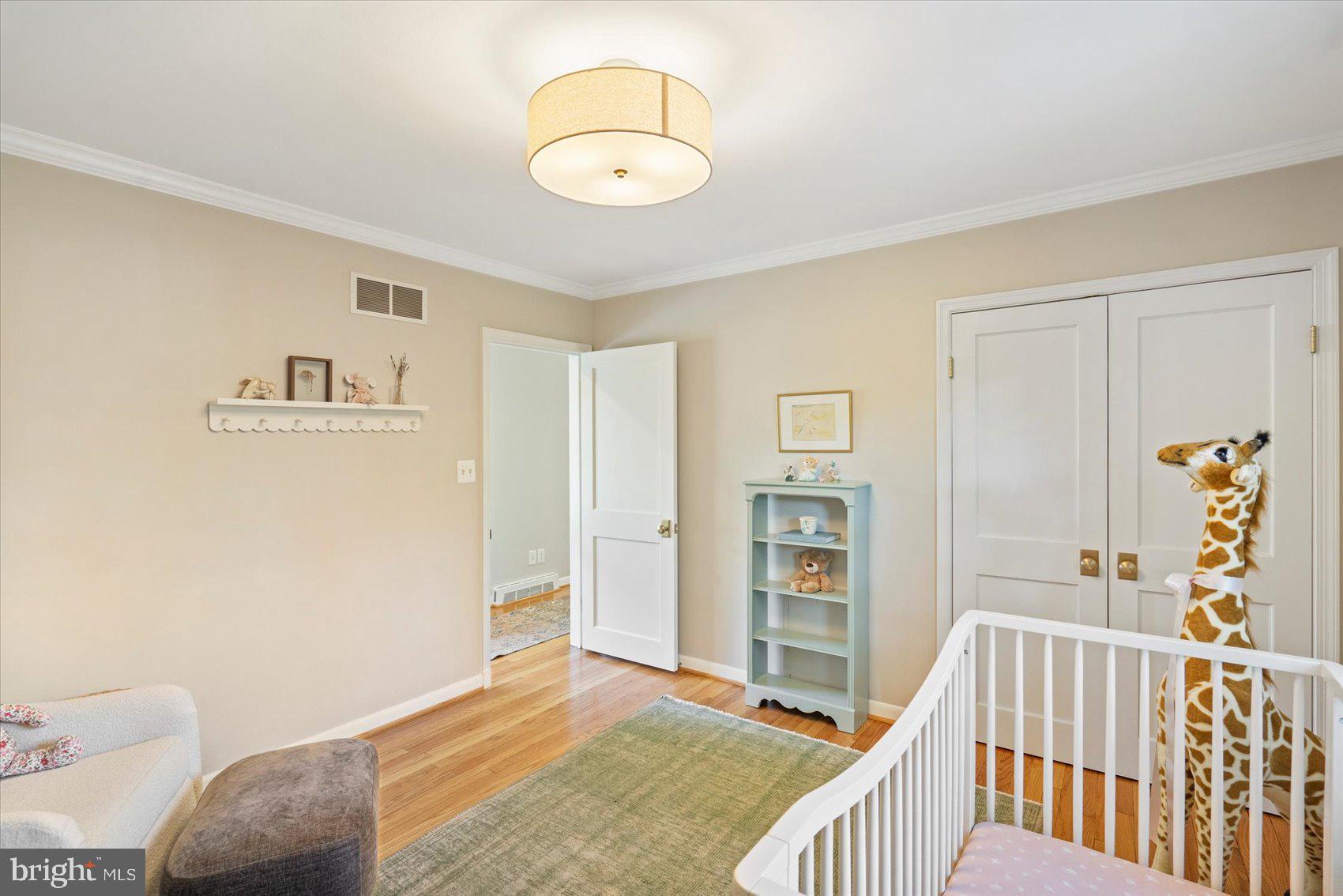 2413 Stanwick Road Phoenix, MD 21131 - Photo 14 of 46 a bedroom with a bed and wooden floor