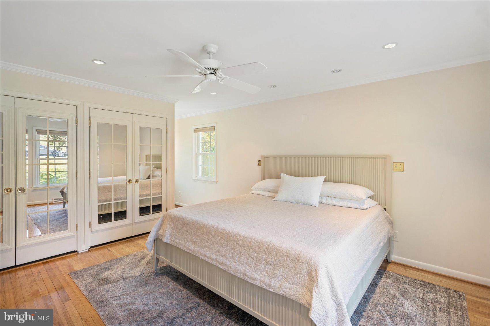 2413 Stanwick Road Phoenix, MD 21131 - Photo 15 of 46 a spacious bedroom with a bed and a walk in closet