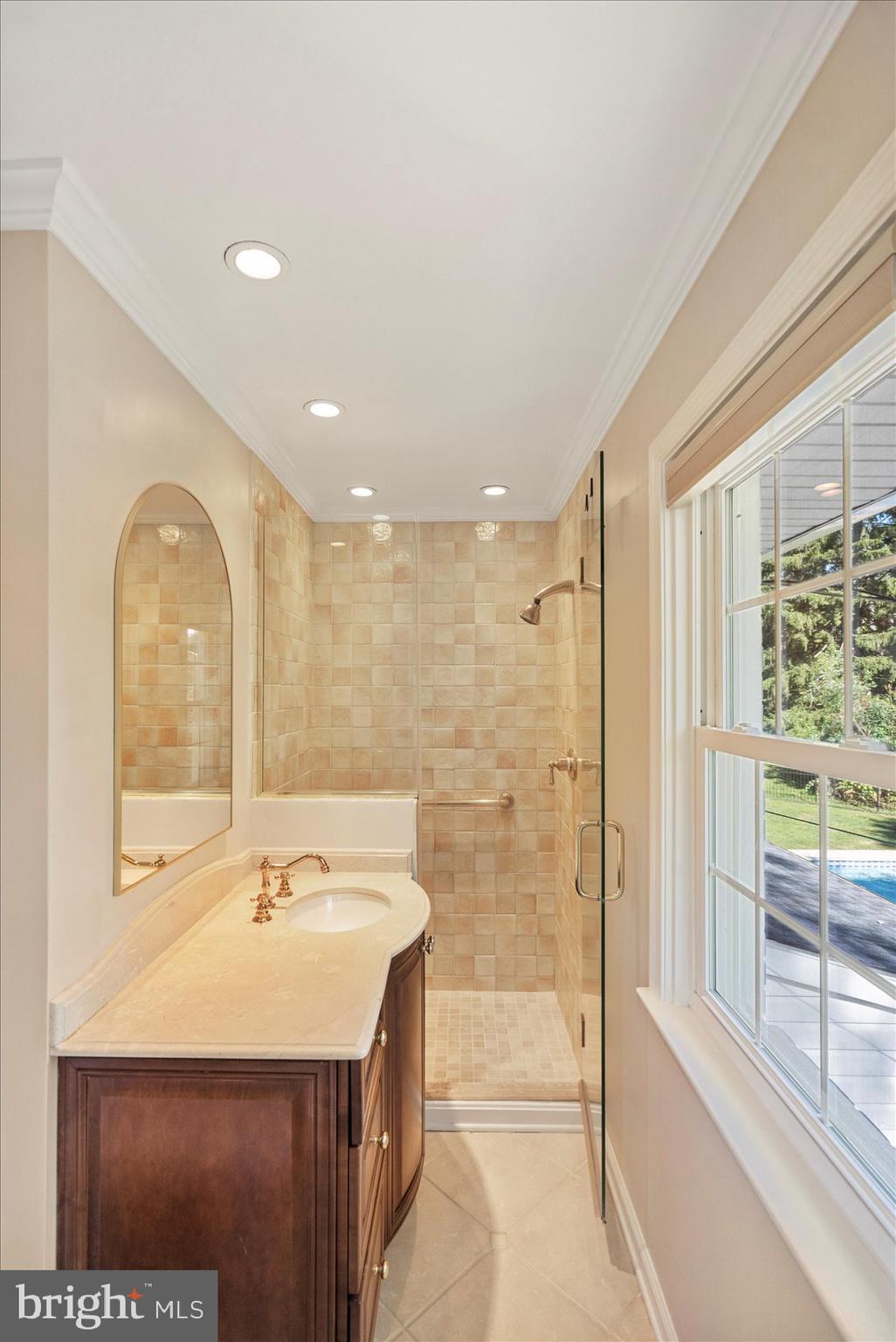 2413 Stanwick Road Phoenix, MD 21131 - Photo 18 of 46 a bathroom with a sink and a mirror