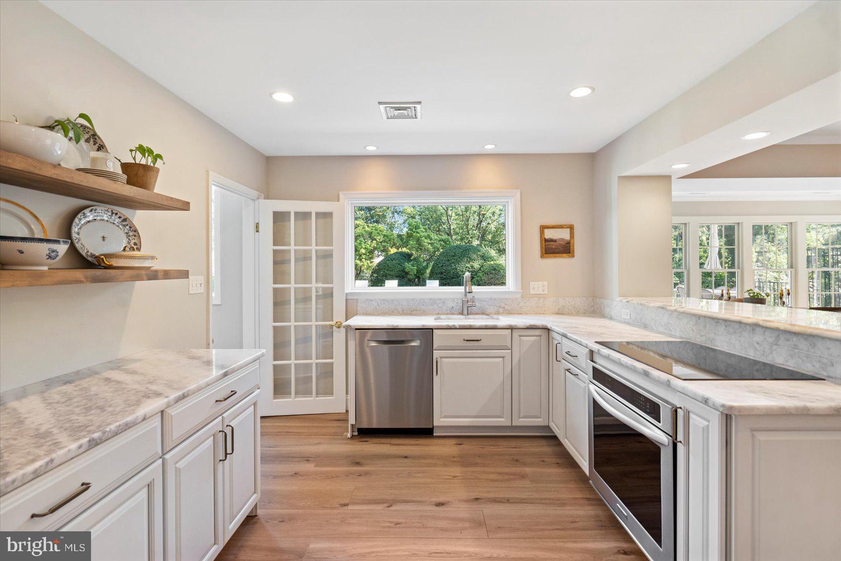 2413 Stanwick Road Phoenix, MD 21131 - Photo 22 of 46 a kitchen with granite countertop white cabinets and appliances