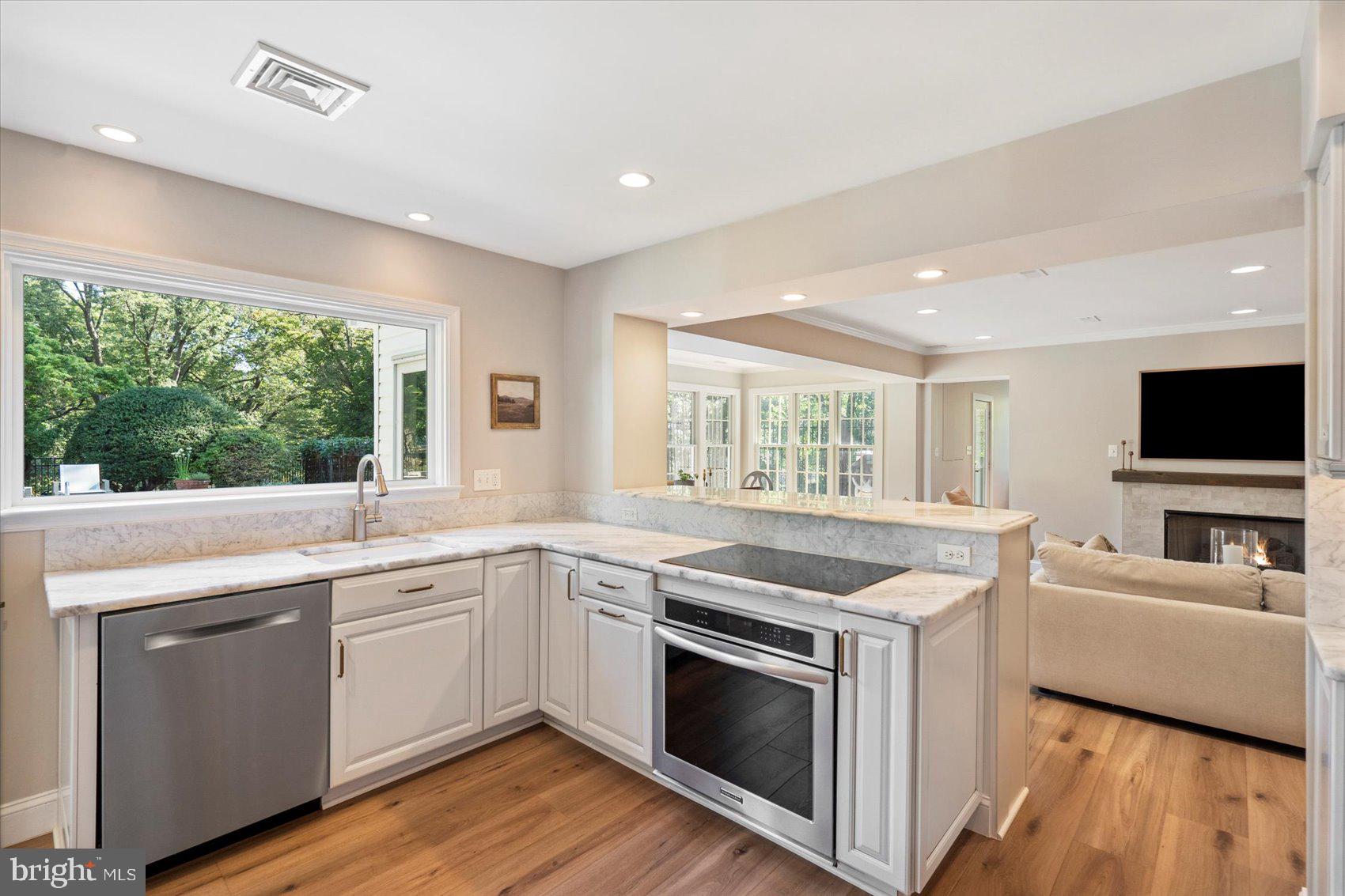 2413 Stanwick Road Phoenix, MD 21131 - Photo 23 of 46 a kitchen with a sink stove and microwave