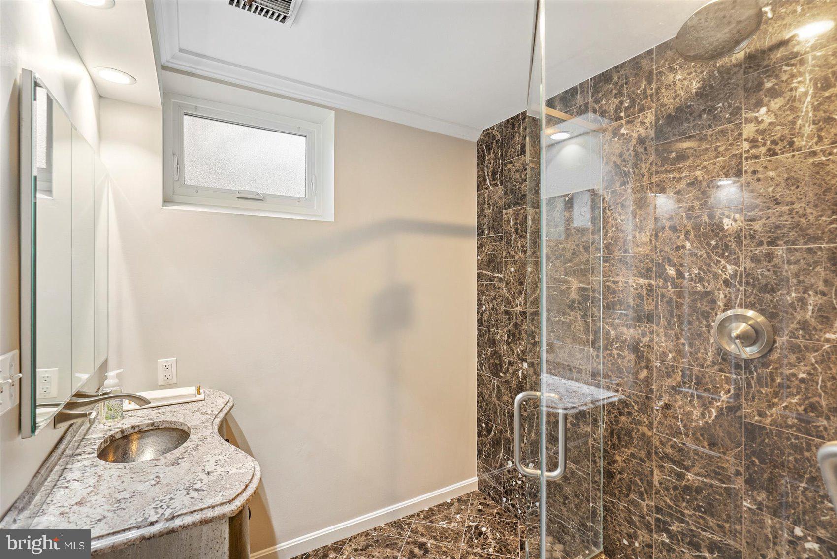 2413 Stanwick Road Phoenix, MD 21131 - Photo 30 of 46 a bathroom with a granite countertop shower a sink and a toilet