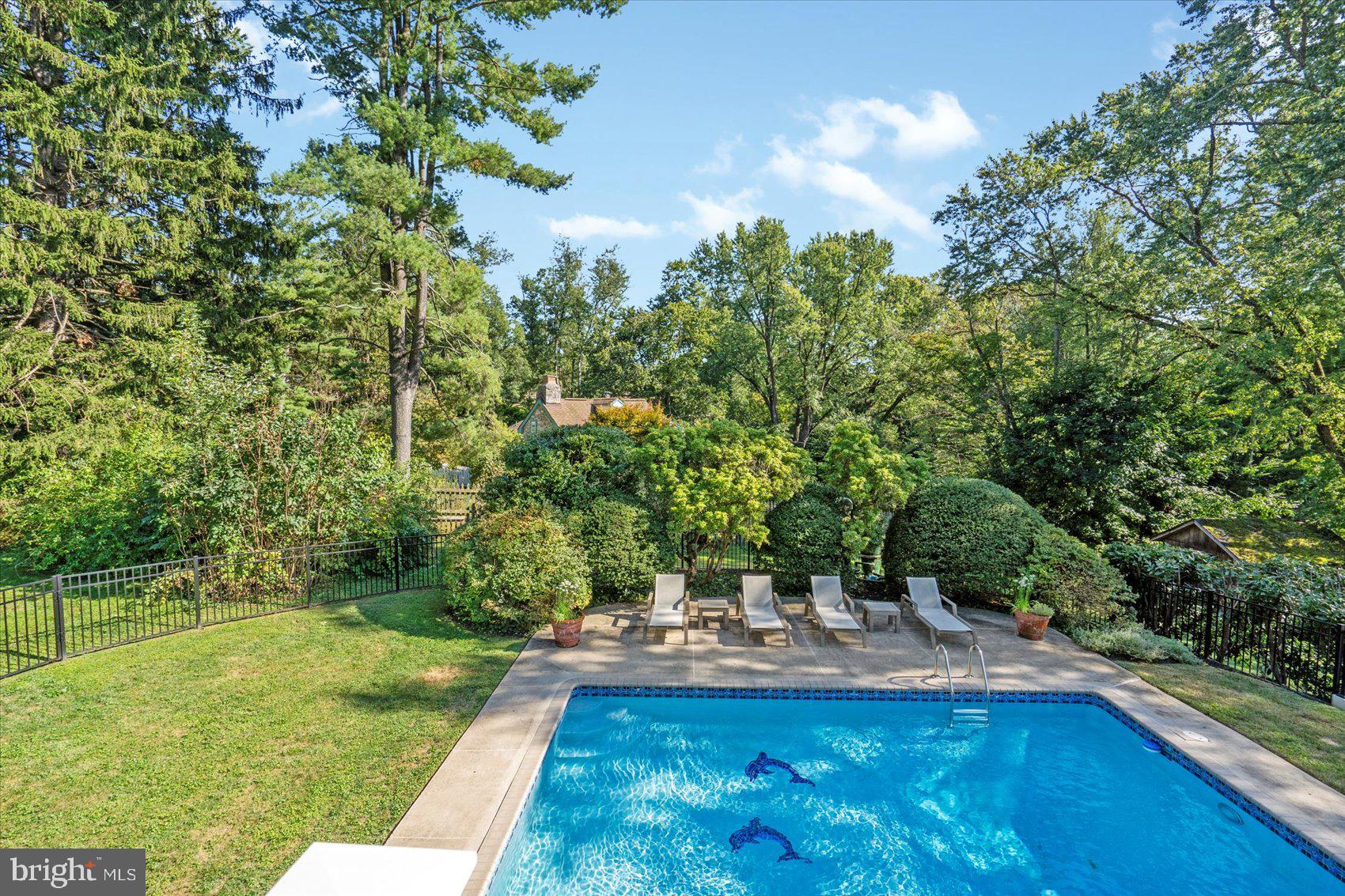 2413 Stanwick Road Phoenix, MD 21131 - Photo 33 of 46 a view of a swimming pool with a patio and a garden