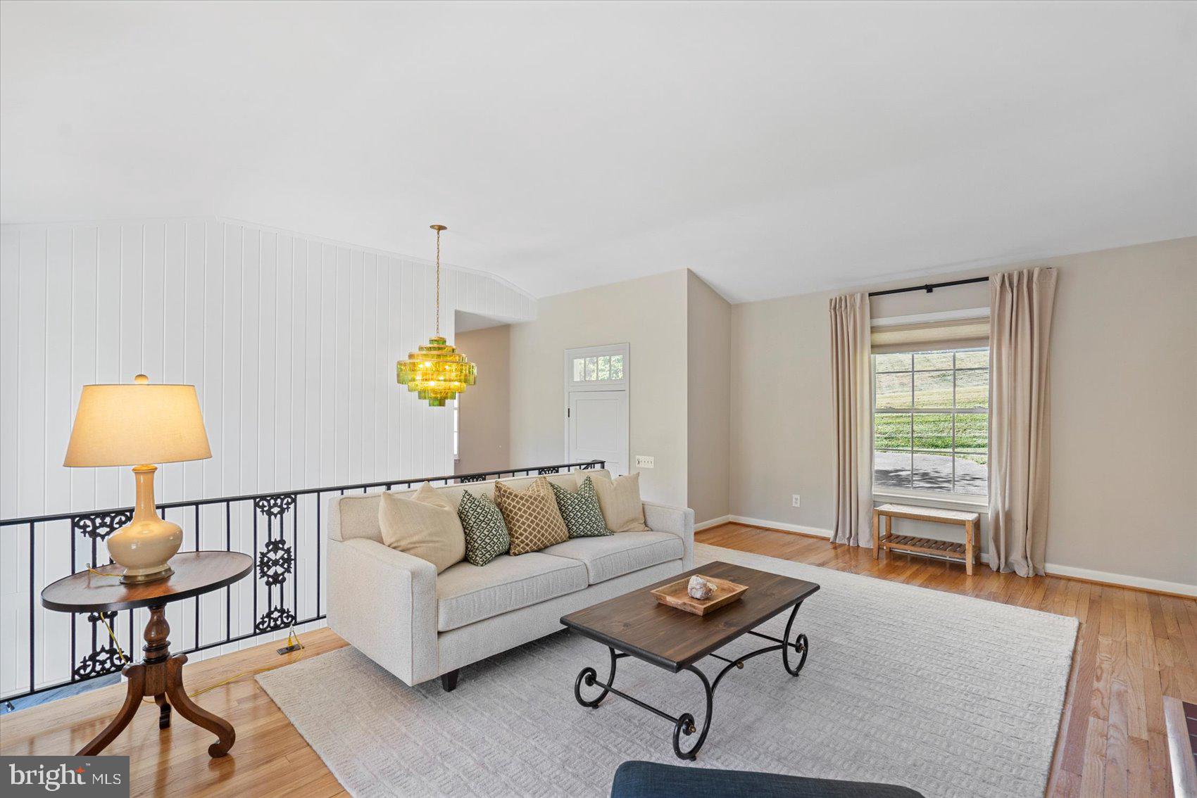 2413 Stanwick Road Phoenix, MD 21131 - Photo 8 of 46 a living room with furniture and a lamp