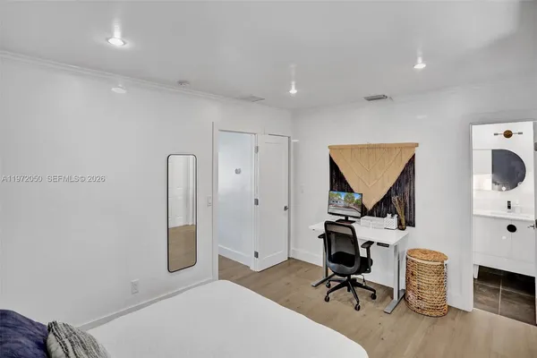 a workspace with furniture and mirror