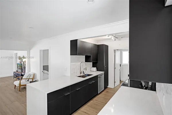 a large bedroom with a large bed and tv