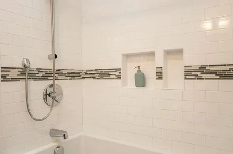 a bathroom with a sink toilet and tub