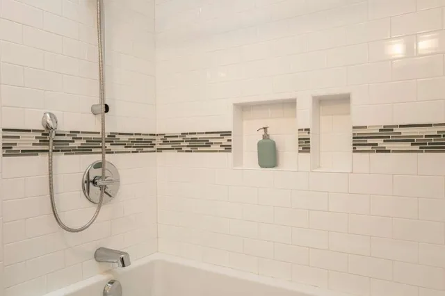 a bathroom with a sink toilet and tub